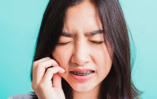 teeth braces pain relief tips - best garden grove orthodontist